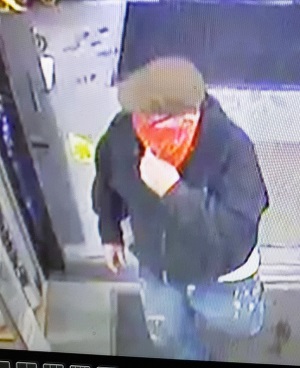 Unidentified suspect wearing red banadana