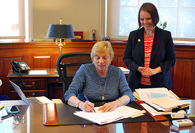 Governor Mills and Senator Shenna Bellows at signing of LD 946