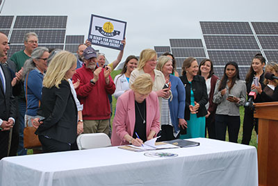 Mills signing energy and climate change bills