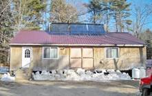 Thermal Project: Evacuated tube solar hot water collector system at NEWAIM fiber mill in Waldoboro, Maine.