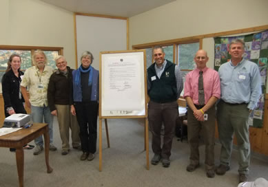 Kennebec Woodland Partnership Key Principles signing, October 2010 Conference. From left: Dale Finseth (KCSWCD), Patrick Strauch (MFPC), Theresa Kercnher(KLT), Jake Metzler (FSM), Don Mansius (MFS), Tom Doak (SWOAM). Not pictured: Beth Ollivier (TCNEF). Photo credit: Andy Shultz