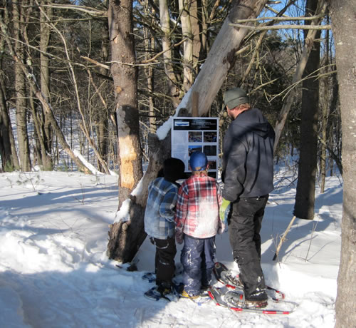 A family enjoys winter fun at Curtis Homestead in Leeds.  Photo credit Pam Bell