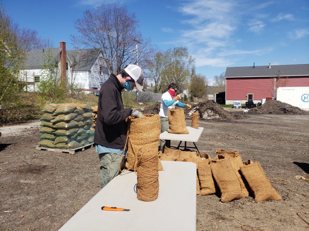 Wrapped filled coir bags