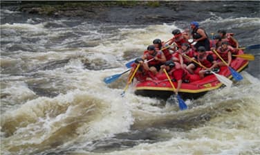 People rafting on river