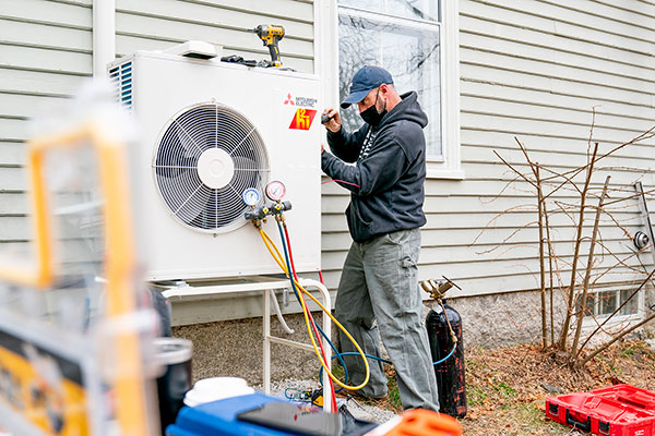 Man working on a heat pump