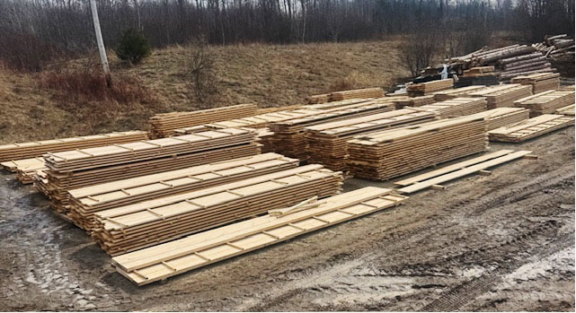 multiple stacks of 2 by 4 wood