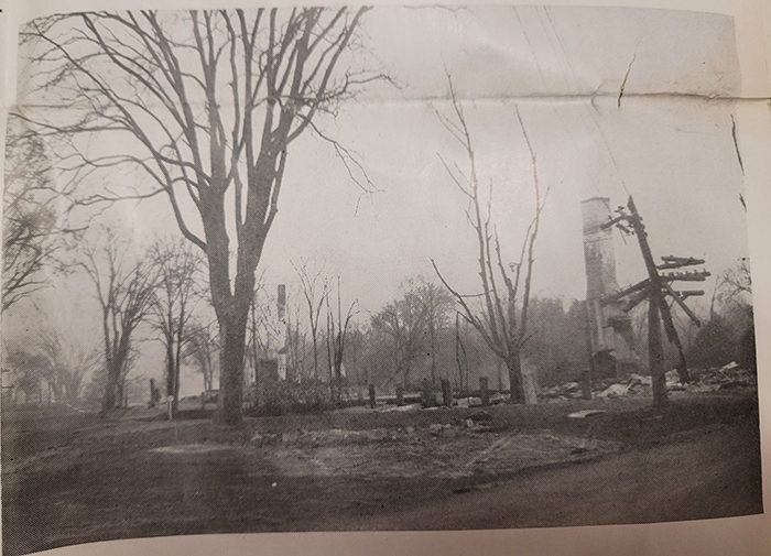 Photo of where the fire destroyed buildings, leaving just chimneys.