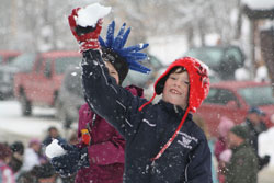 youth throwing snowball on a winter day.