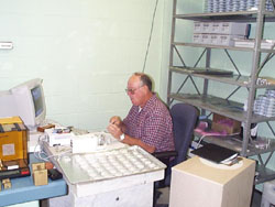 John micro-weighs air filter samples