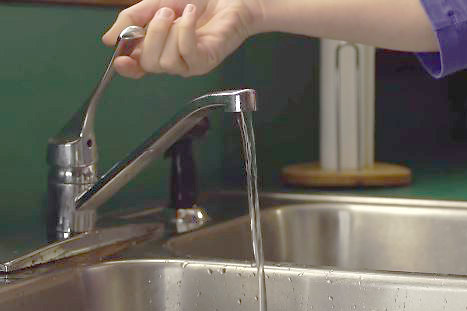 Water running from a kitchen faucet