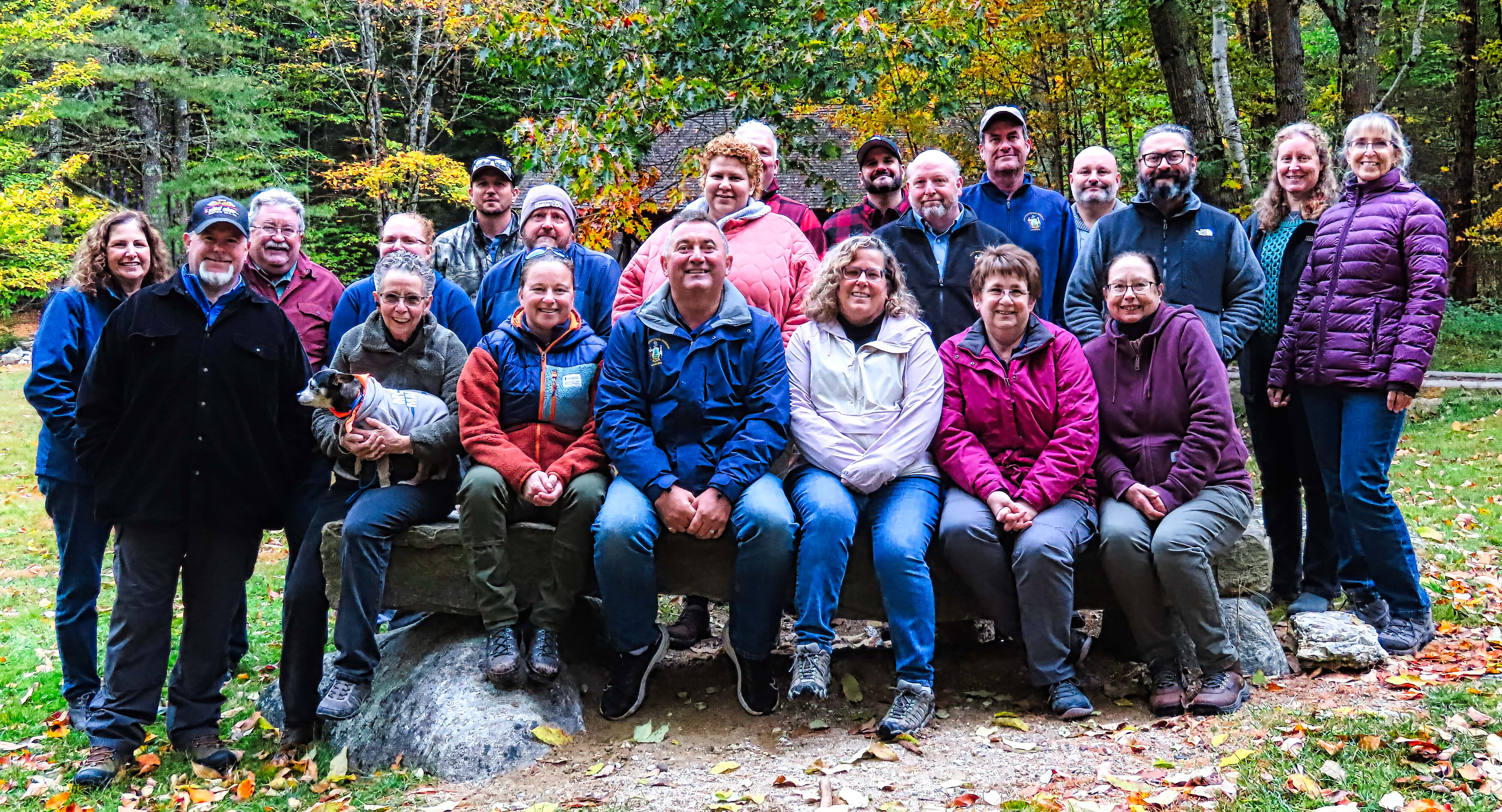 The staff of the Health Inspection Program posing in the woods