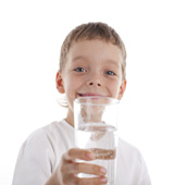 boy holding glass of water