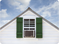 house gable end with window airconditioning unit