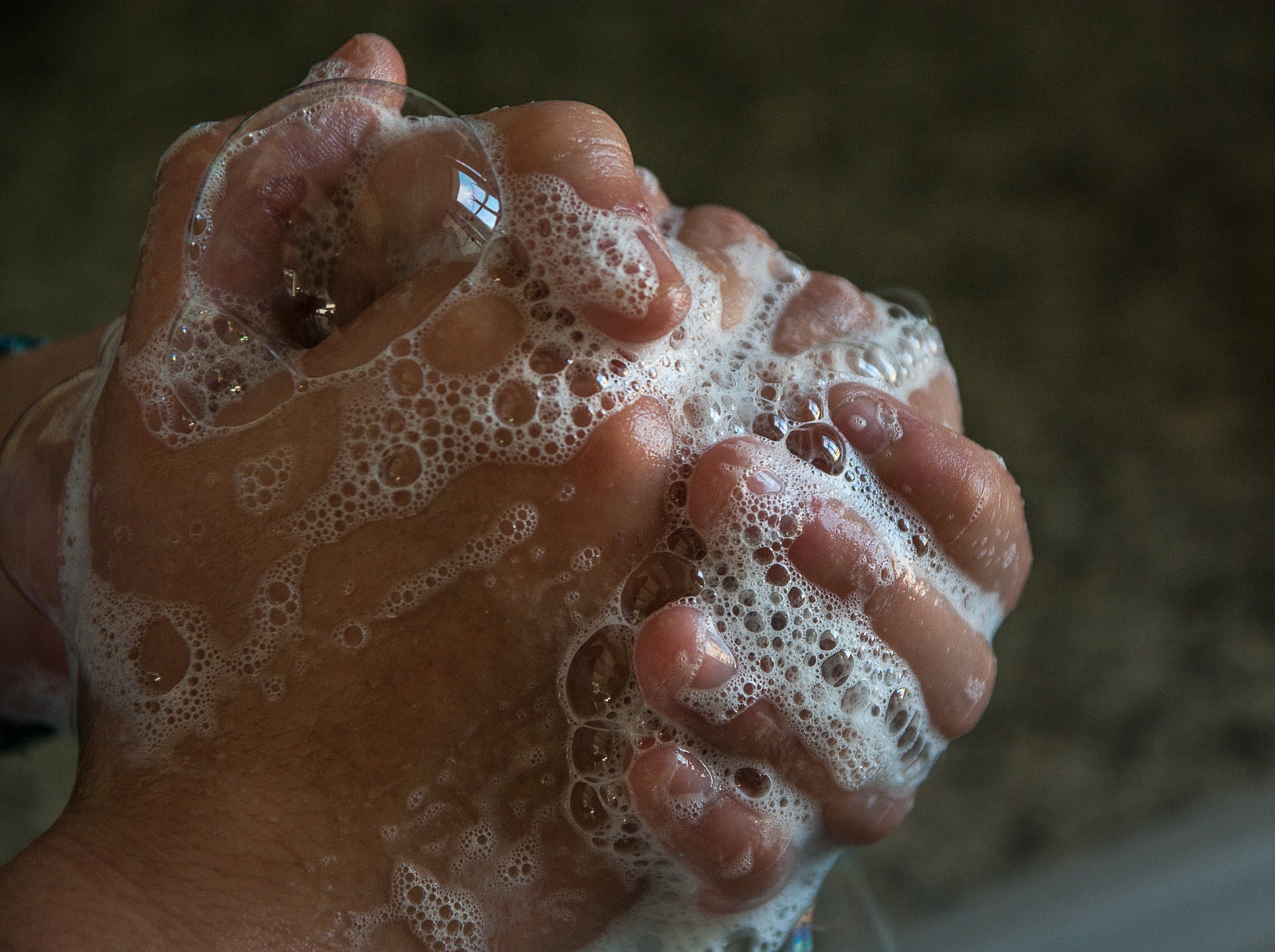 person washing their hands