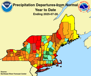 Map of New England and New York, identifying departures in normal precipitation by county.