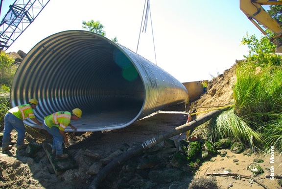 Crane lowering big culvert, photo by Slade Moore