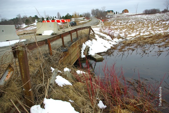 Closed bridge crossing with barriers, photo by Slade Moore