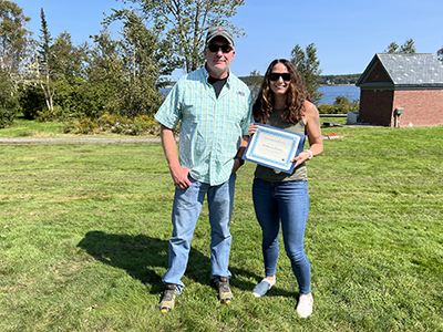 DMR Employee of the Year Rebecca Peters with Commissioner Patrick Keliher