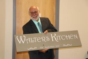 Walter Holding Sign