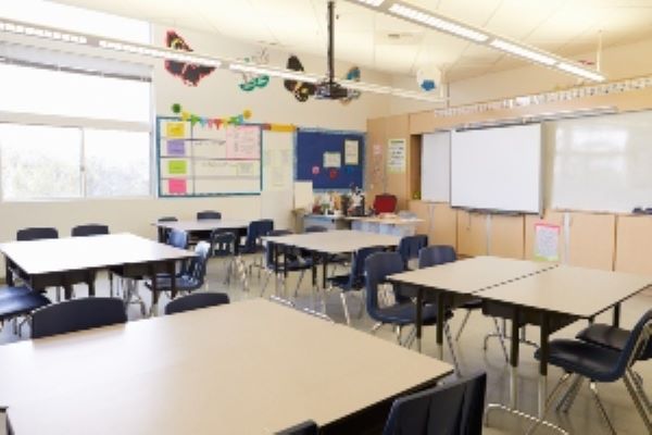 public school classroom with desks arranged into tables