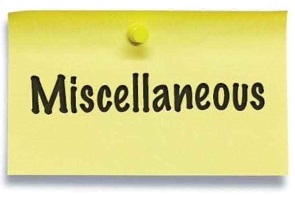 The word Miscellaneous written on yellow paper with a yellow push pin
