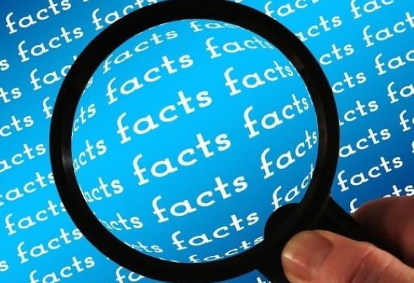 magnifying glass highlighting the word facts