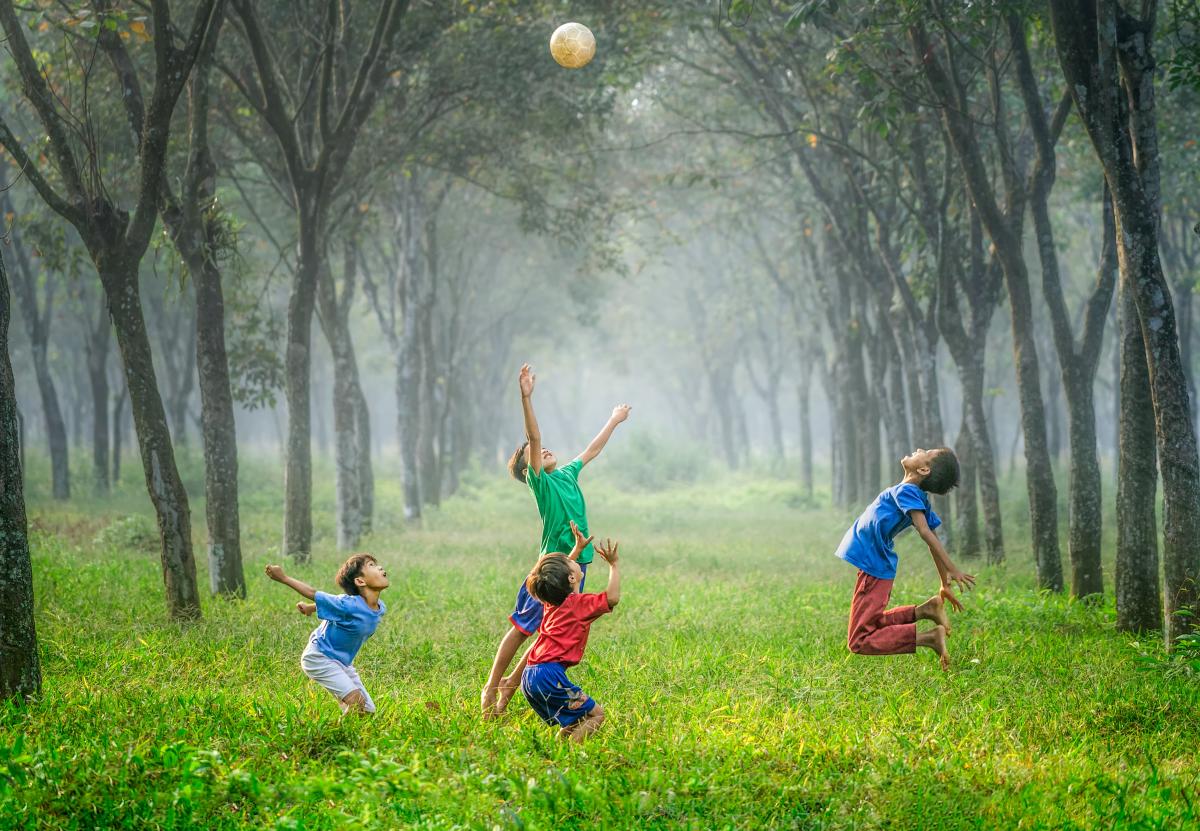 4 Children Playing with a ball