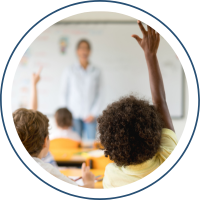 Student raising his hand in class