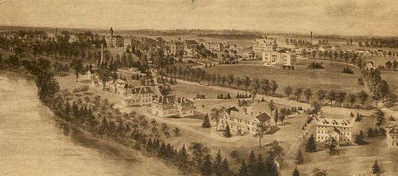 Image of university campus with buildings and river