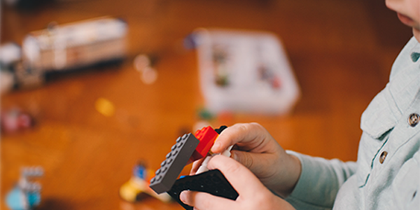 kid building with blocks