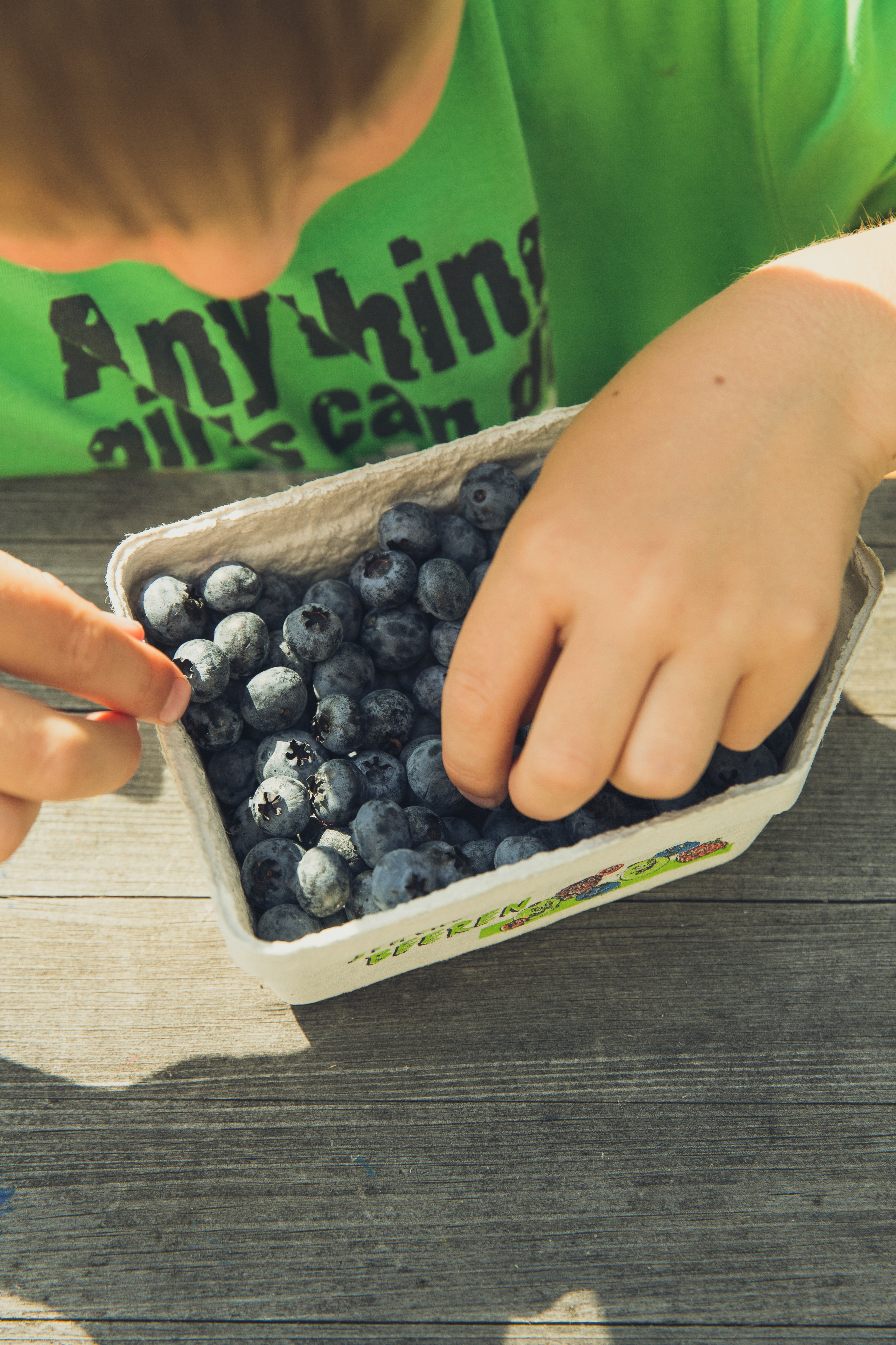 Boy with blueberries