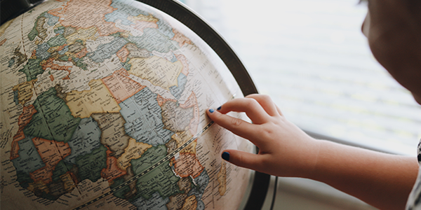 Child looking at Globe