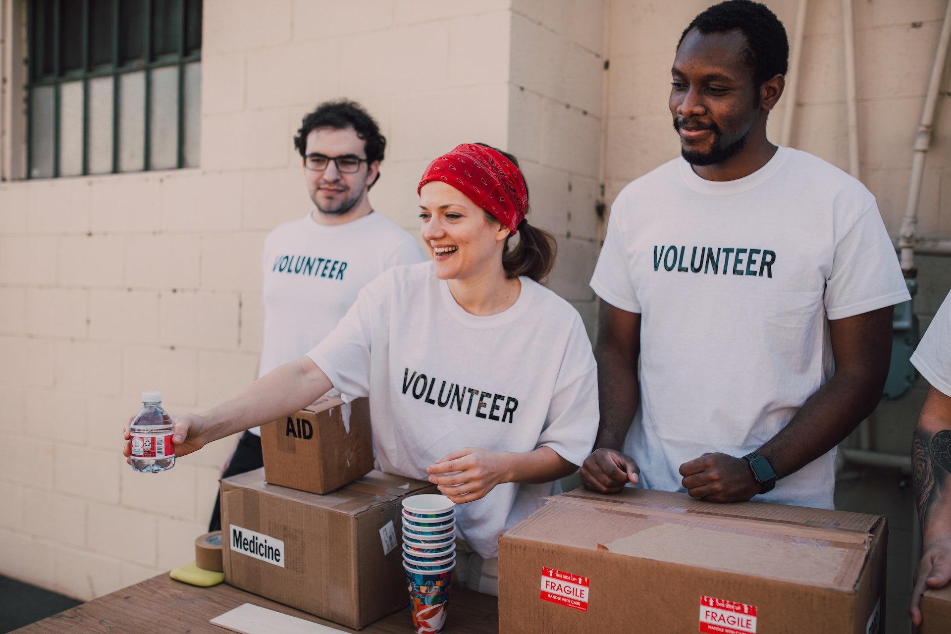 Volunteers handing out water to community