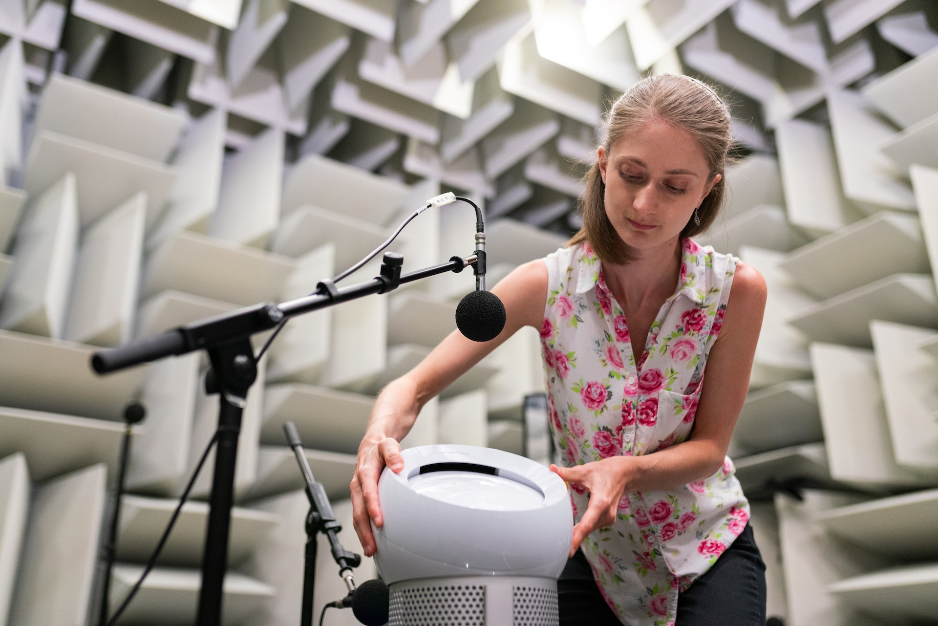 Person setting up microphone to test sound