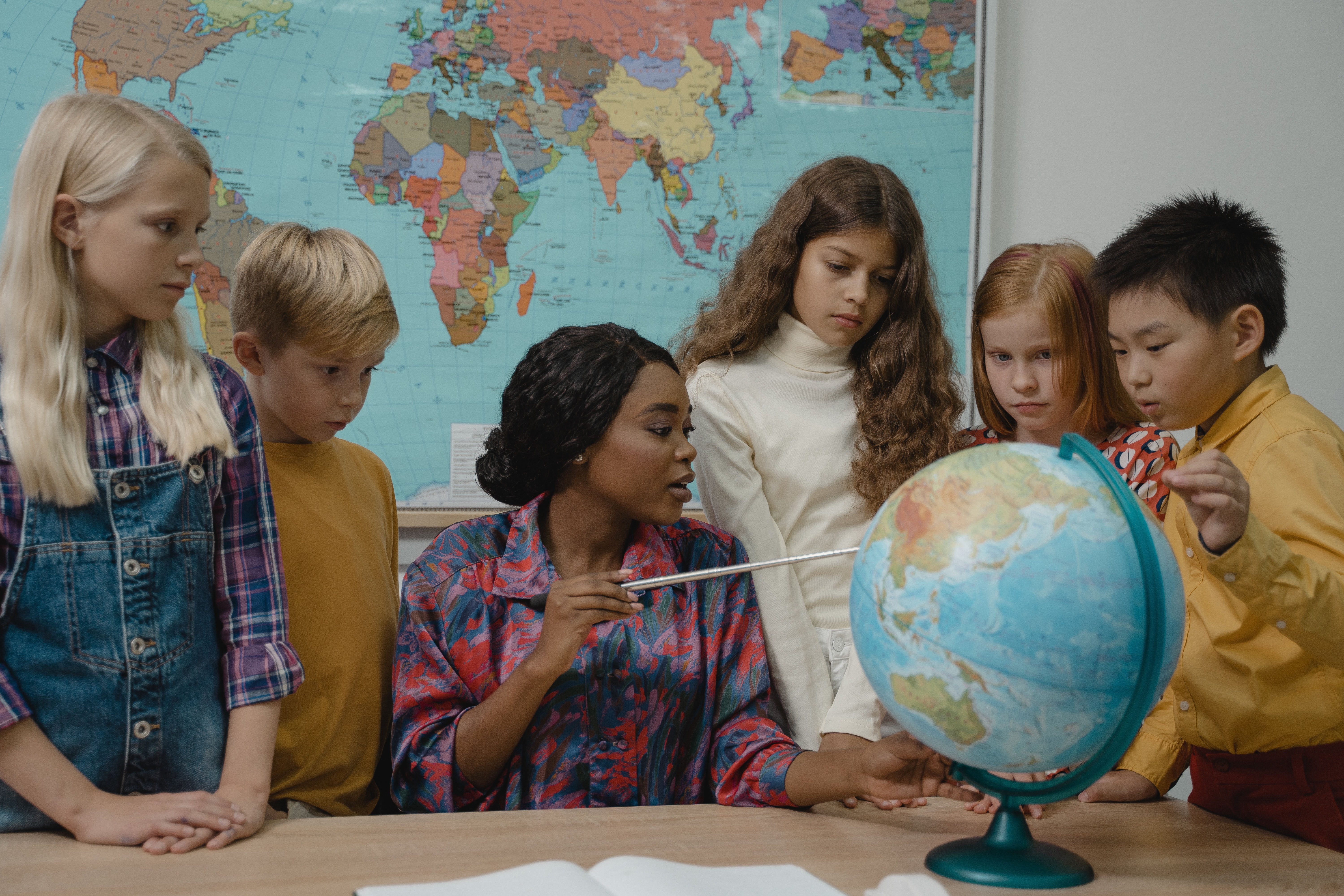 teacher with globe