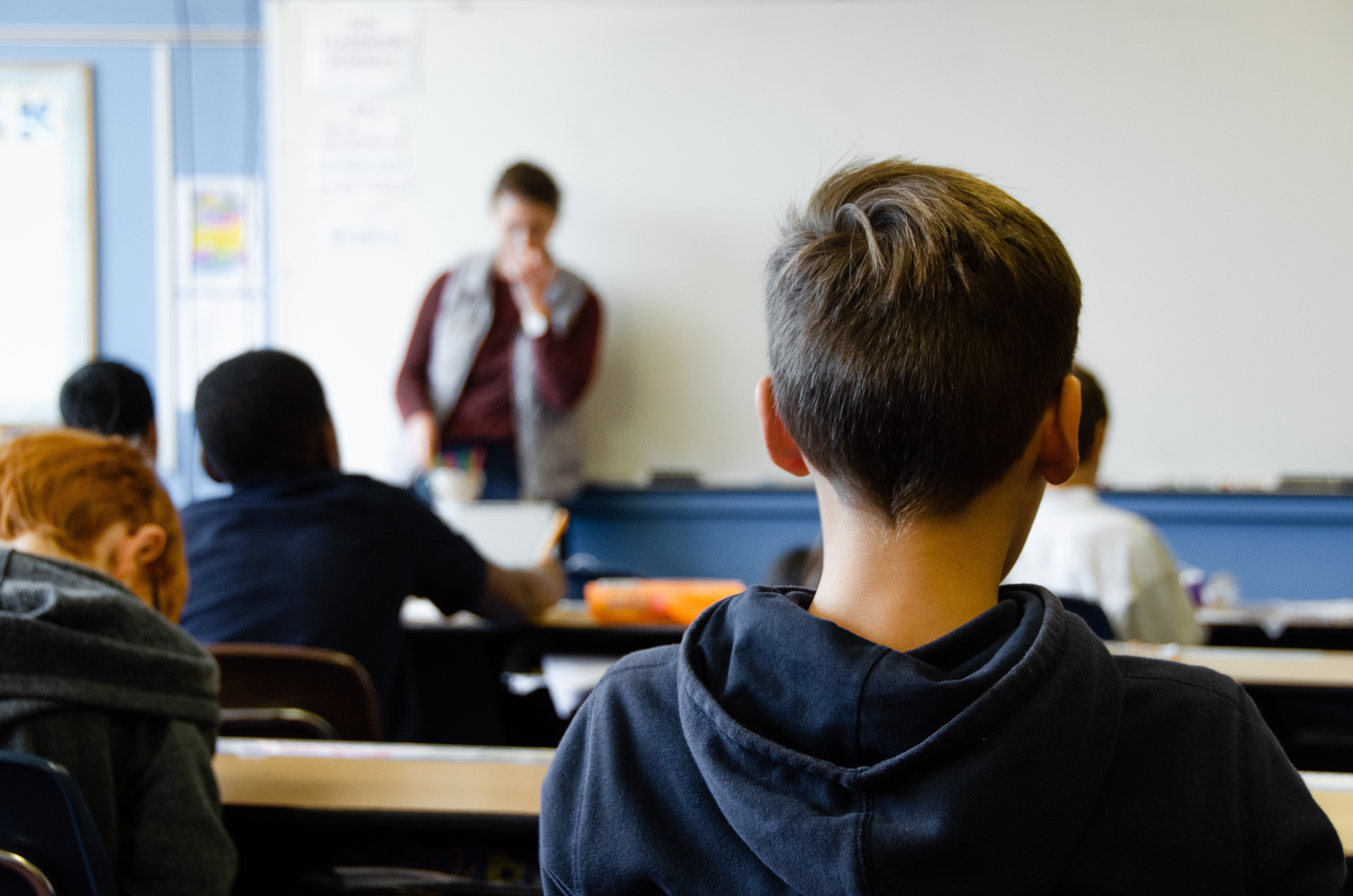 Child sitting at desk in classroom