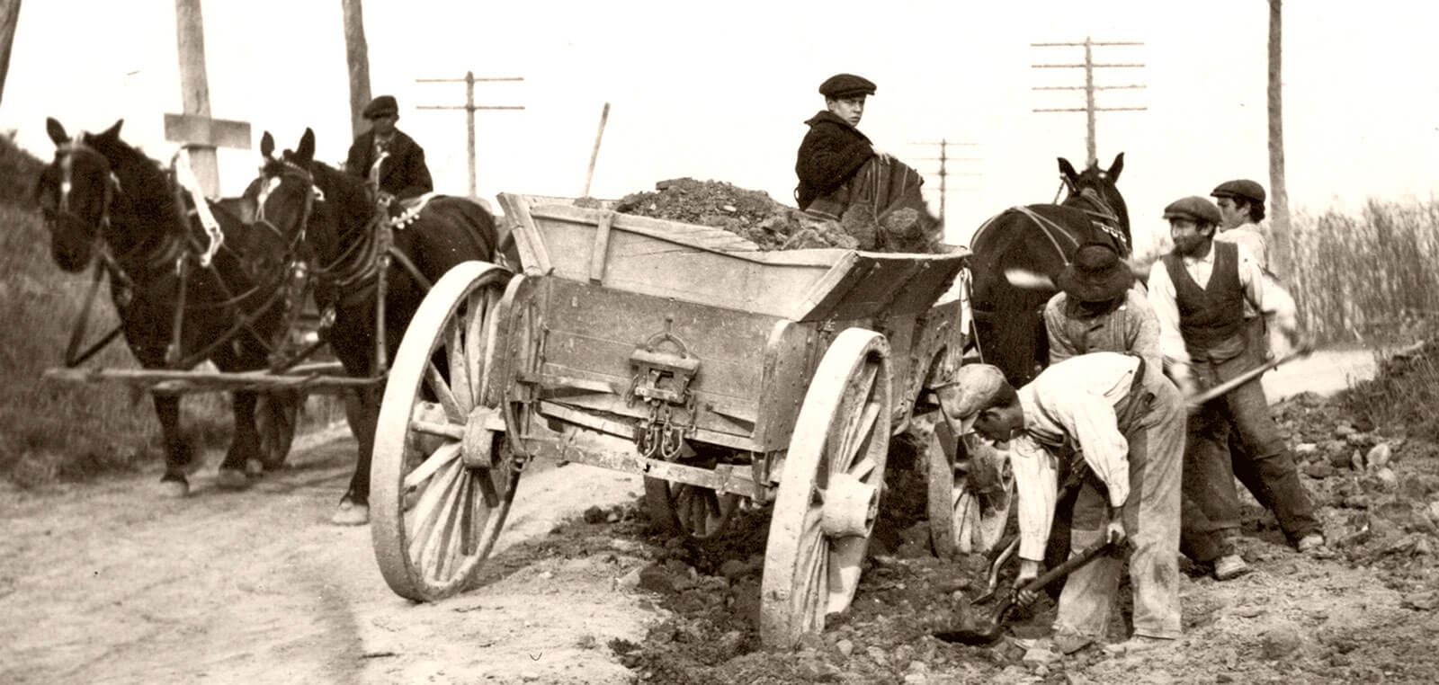Horse drawn carriage off of the side of the road