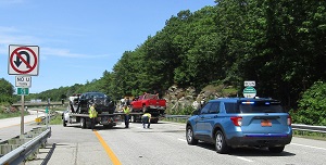 Crash scene vehicles being cleared off interstate
