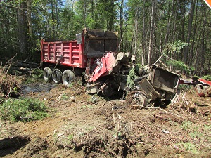 Crashed red dump truck