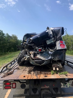 Pittsfield crash vehicle on a flatbed trailer 