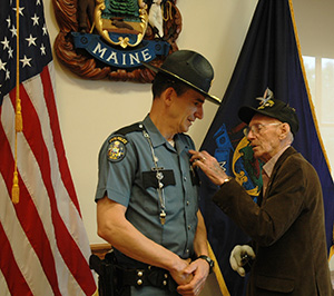 Father pinning badge