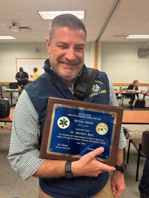 Dr. Sholl with his 21 year service award from Maine EMS