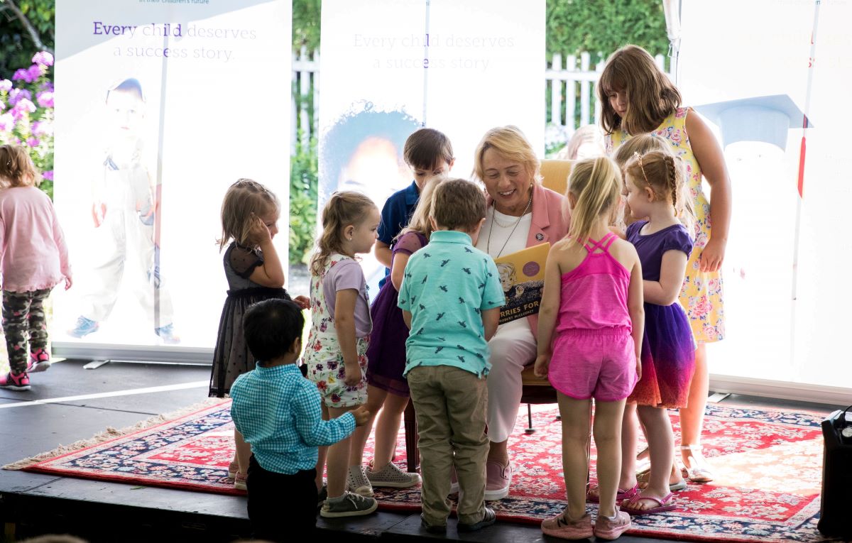 Governor Mills reading Blueberries for Sal to children