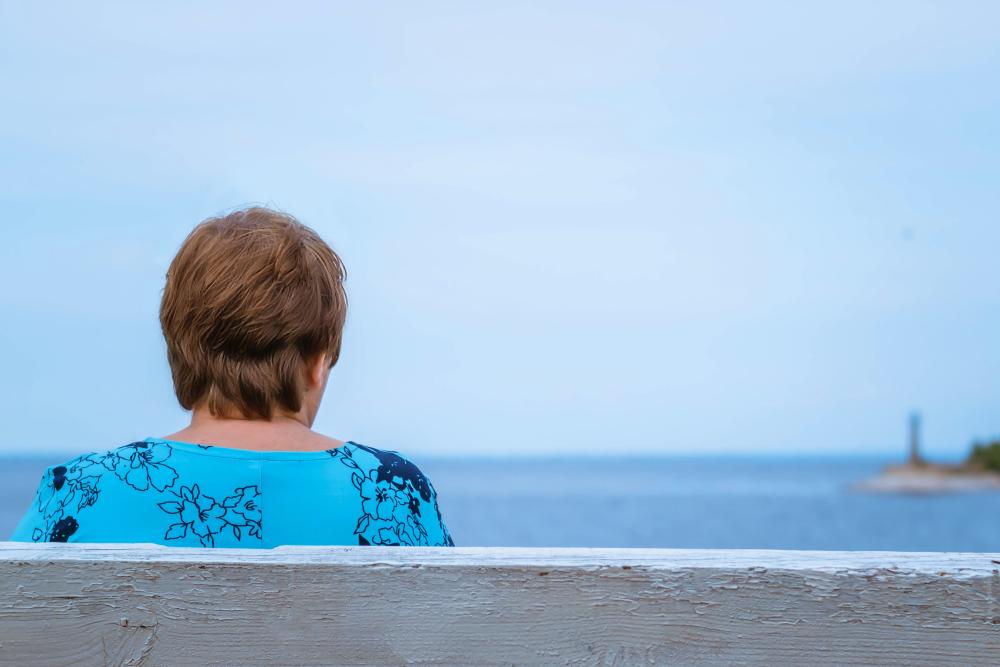 What is Elder Abuse woman facing away toward the ocean