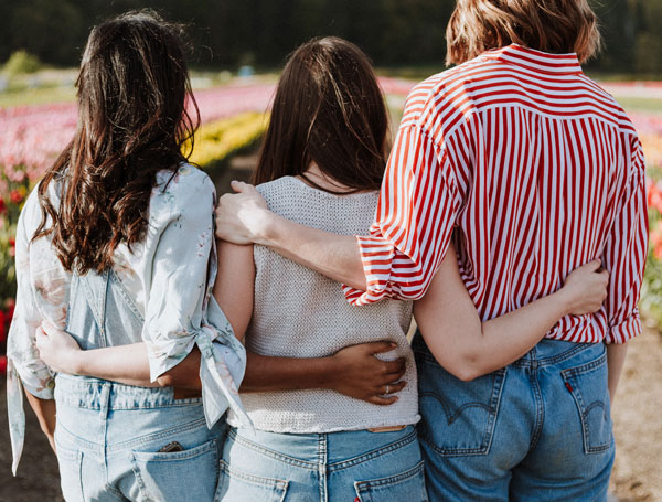 Photo of women arm-in-arm