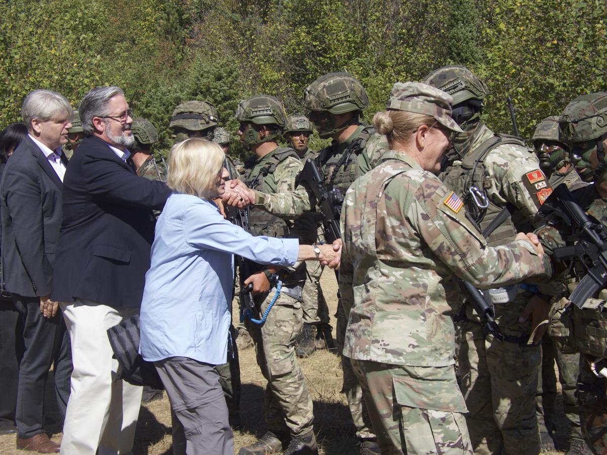 Governor Mills shakes hands with participants of tactical demonstration.