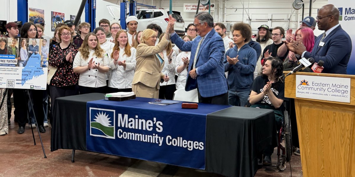 Governor Mills high-fives David Daigler, President of the Maine Community College System