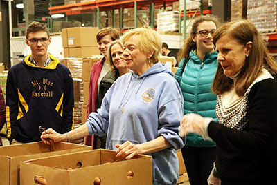 Governor Mills Volunteers At Good Shepherd Food Bank On Statewide