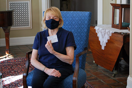 Governor Mills shows her vaccination card
