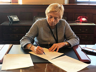 Governor Mills signing Executive Order 1